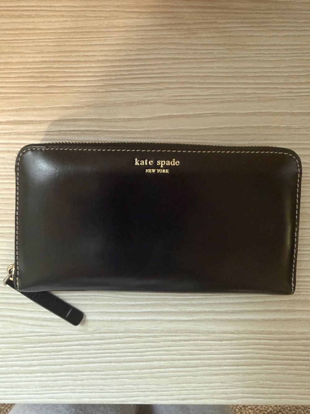 kate spade black zip-around leather wallet with gold logo